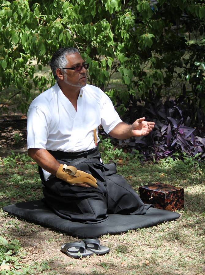 Toby Bernal explains kyudo at a demonstration at the Austin Zen Center's Spring Fair. Toby Bernal explains kyudo at a demonstration at the Austin Zen Center's Spring Fair.
